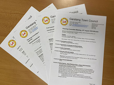 Garstang Town Council agendas and minutes hard copies on a desk